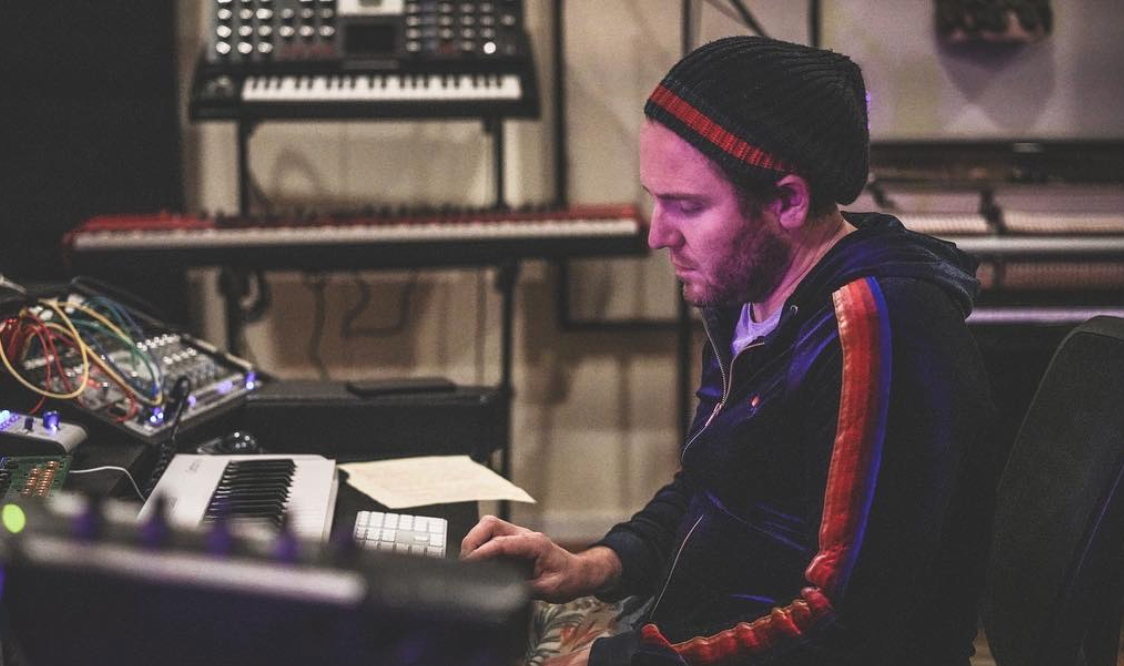 Roc at the keys at ESCAPE — modular gear, console behind