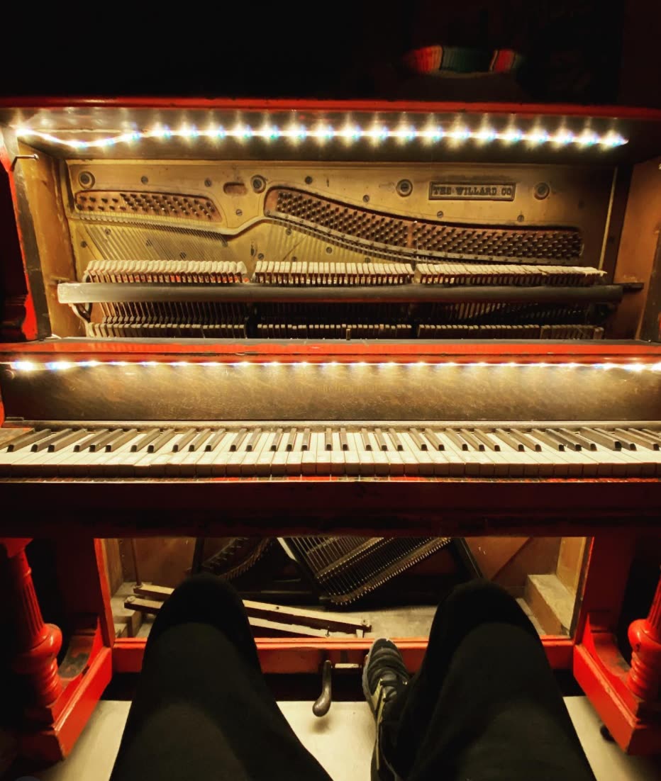The piano in the saloon at ESCAPE
