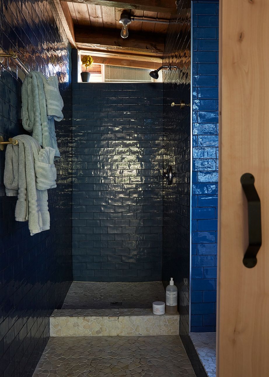 The blue-tiled shower in the spa at ESCAPE