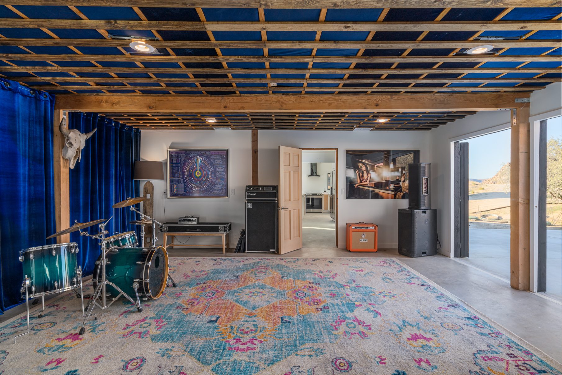 Studio Two live room at ESCAPE — blue ceiling, longhorn skull, doors open to the desert